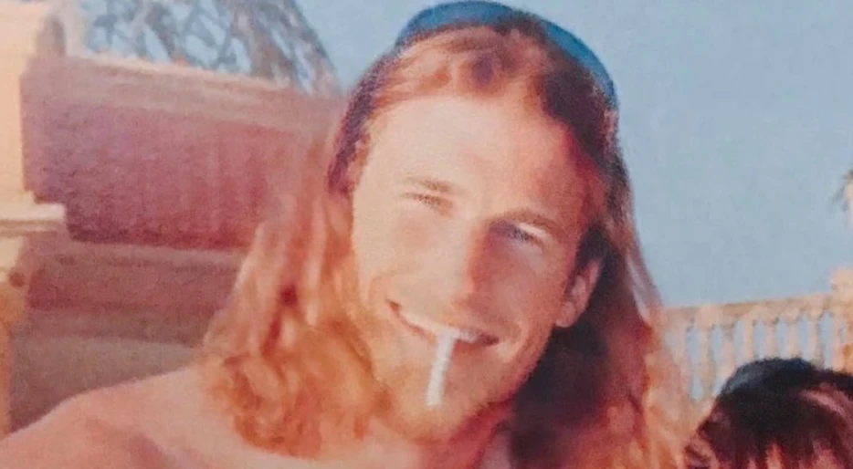 PHOTO: Lions HC Dan Campbell Has Social Media In A Frenzy Over His Shirtless Picture With Female In Bikini From 26 Years Ago