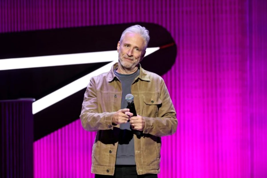 Jon Stewart wore an Eagles jersey to a Knicks game after losing a bet with Jalen Brunson