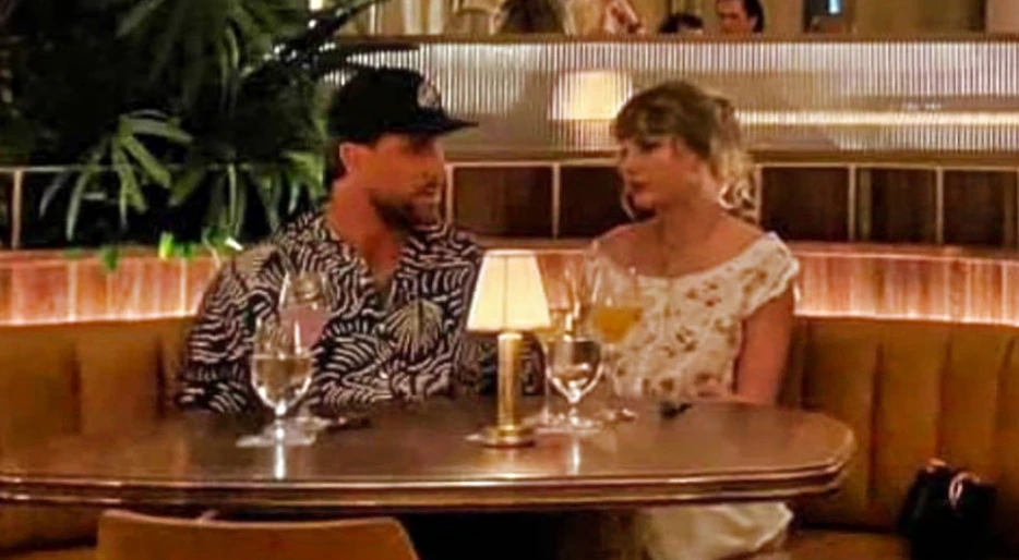 Cameras Caught Taylor Swift &amp; Travis Kelce Having “Cozy” Dinner Date In Florida, And Their Body Language Says It All