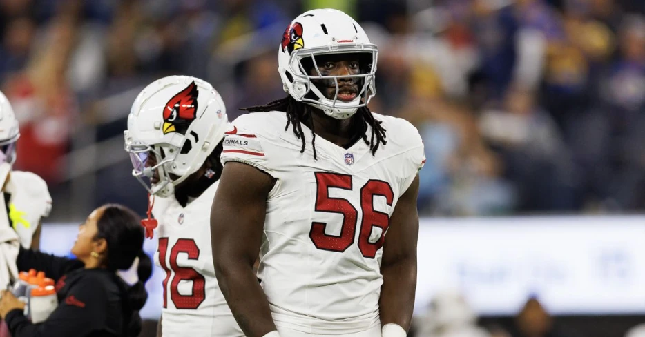 Who starts along the defensive line for the Arizona Cardinals?