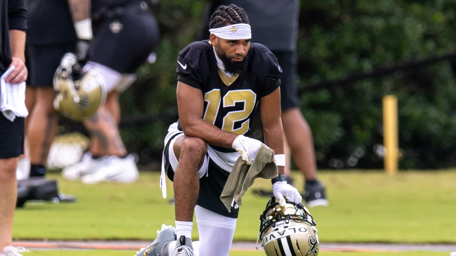 Chris Olave’s Comically Large Guardian Cap Steals The Show At New Orleans Saints Training Camp