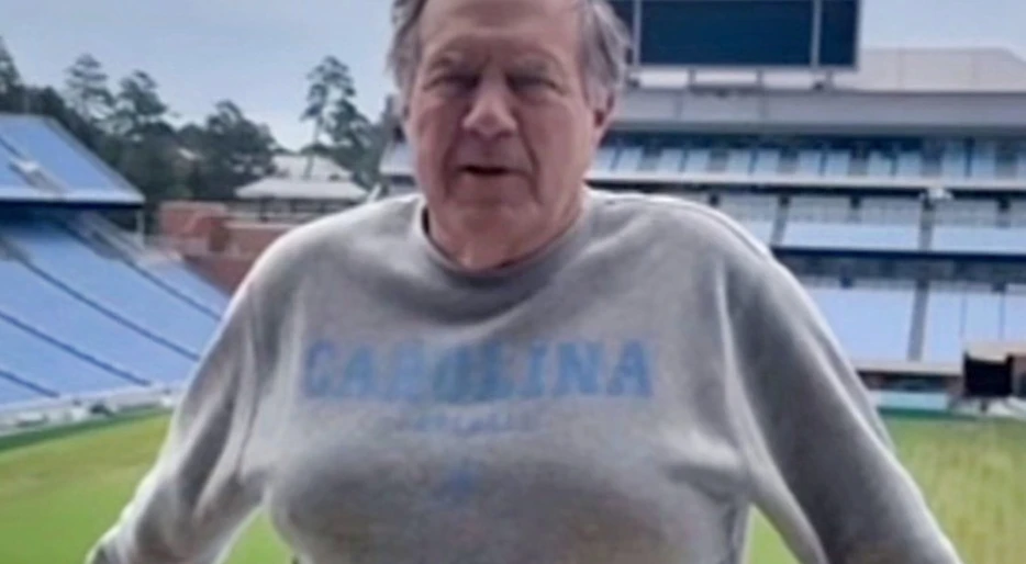 PHOTOS: Everyone Was Making The Same Cruel Joke After Noticing Something Very Odd About Bill Belichick’s Appearance As He Posed In Sweater &amp; Shorts At UNC