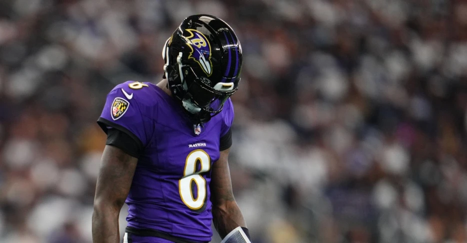 Lamar Jackson exits practice with S&amp;C Coach Elliott and Chief Medical Officer