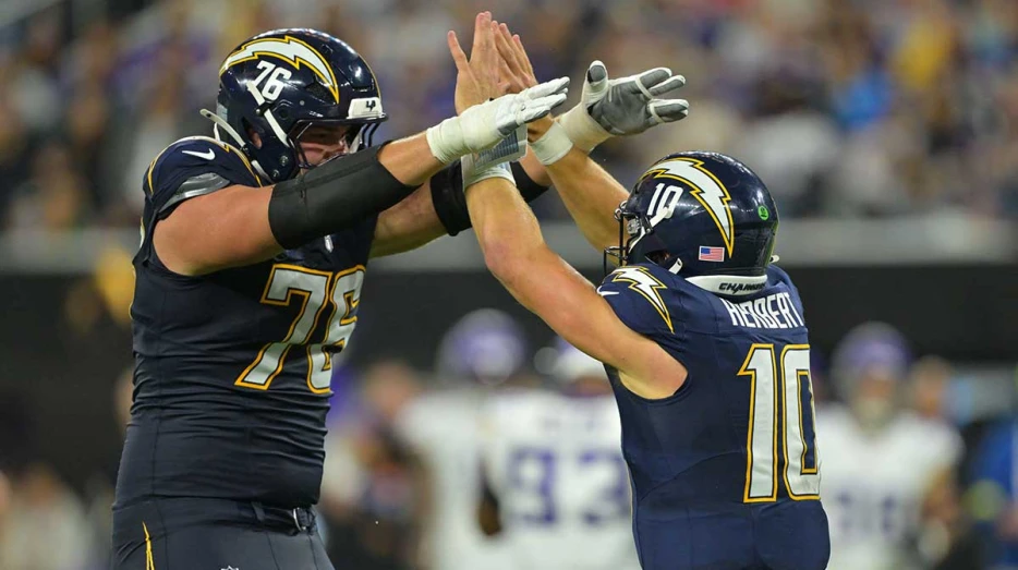 Chargers HC Jim Harbaugh praises Joe Alt, even his kids love him