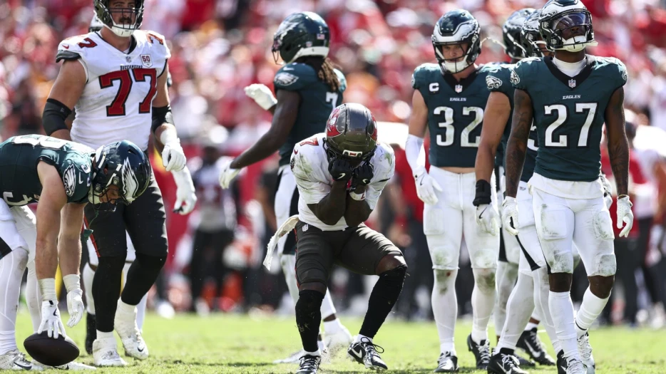 Bucky Irving is on crutches and wearing a protective boot with foot/ankle injury