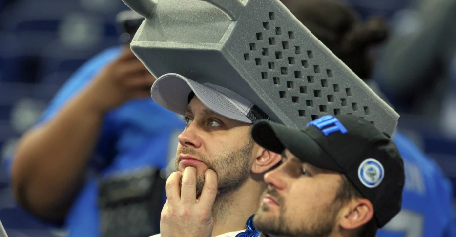 The Bears’ players are all wearing cheese grater hats