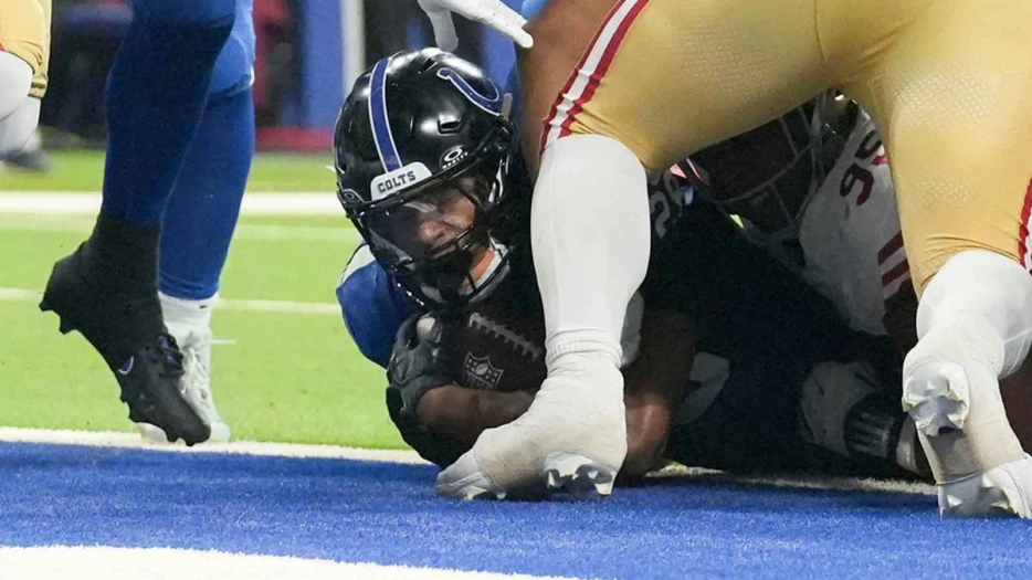 Colts’ Jonathan Taylor pushes the pile for tough TD