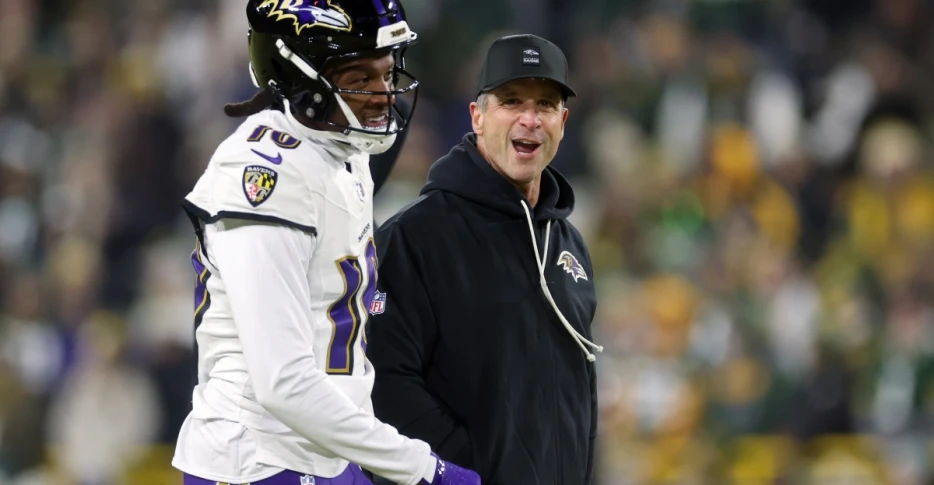 Jon Harbaugh watching film on Titans Cam Ward