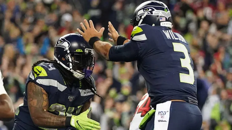 Seahawks icons Russell Wilson, Marshawn Lynch back in Seattle for World Cup match