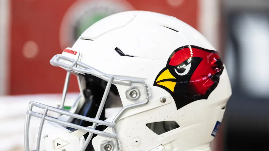 Cardinals sign three draft picks, cut WR Andre Baccellia